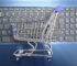 A miniature shopping cart placed on a laptop keyboard symbolizing online shopping and e-commerce.
